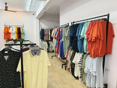 Shelving Display of Premium Men's Polos and Accessories